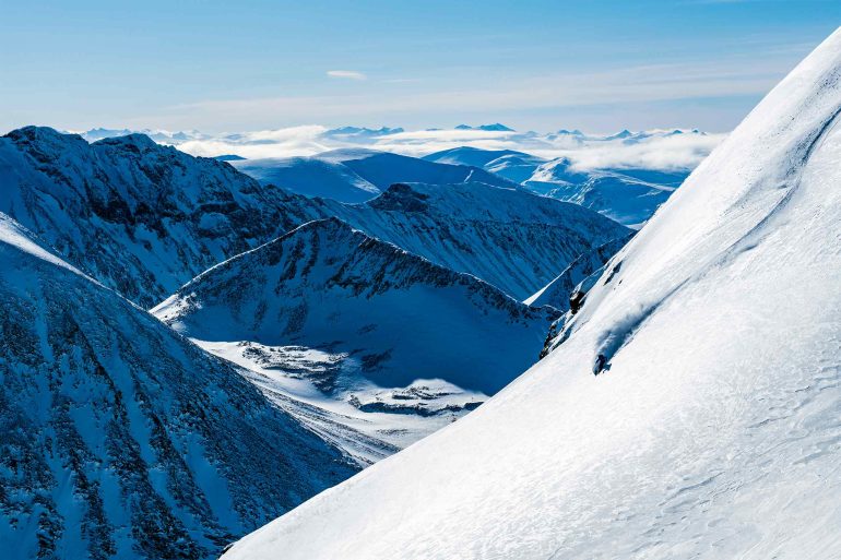 A skier on his way down a mountain in Swedish Lapland, Sweden