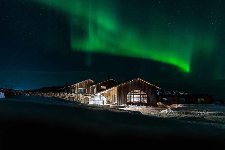 The Northern lights dance in the skies above Niehku Mountain Villa, Riksgränsen, Sweden