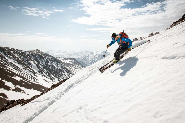A skier on their way down a steep mountain in Swedish Lapland, Sweden