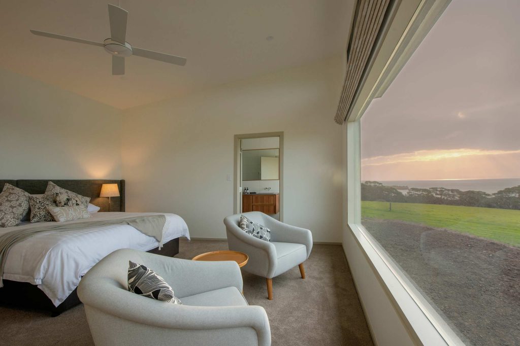 Neutral-coloured bedroom with panoramic views of Kangaroo Island