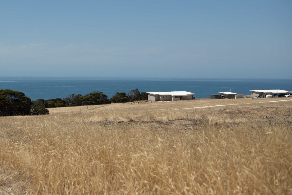 Oceanview Eco Villas between fields of dry grasses and the vast ocean