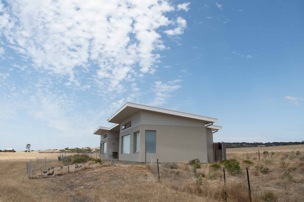 External view of Oceanview Eco Villas with the blue sky surrounding it