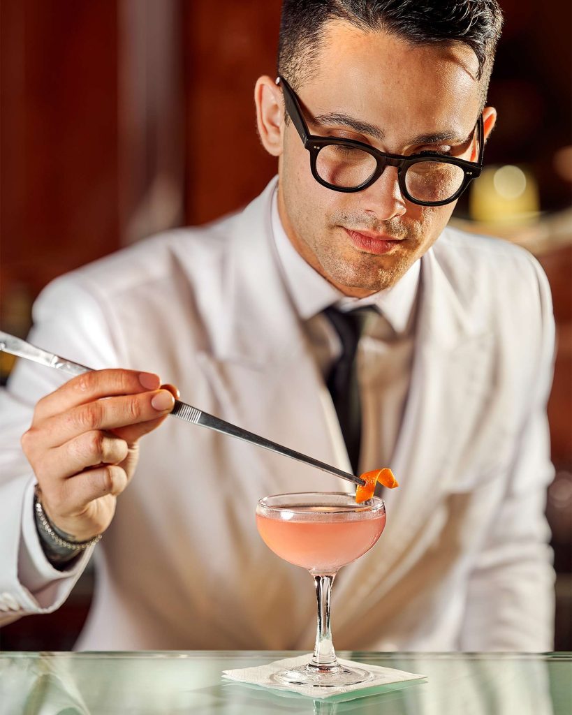 A mixologist prepartes a cocktail in Marbella, Spain