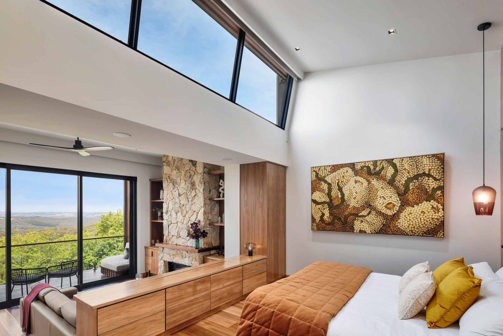 A thoughtfully designed bedroom with stunning views at Sequoia Lodge, Adelaide, Australia