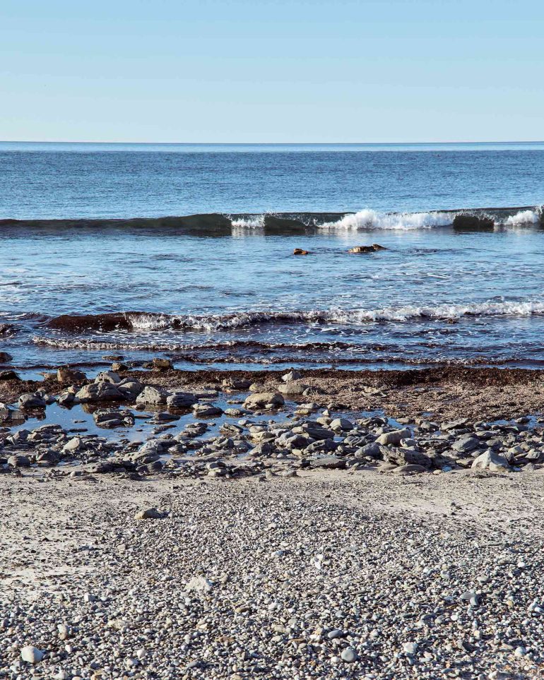 Waves lapping onto the shore in Myponga Beach, Australia