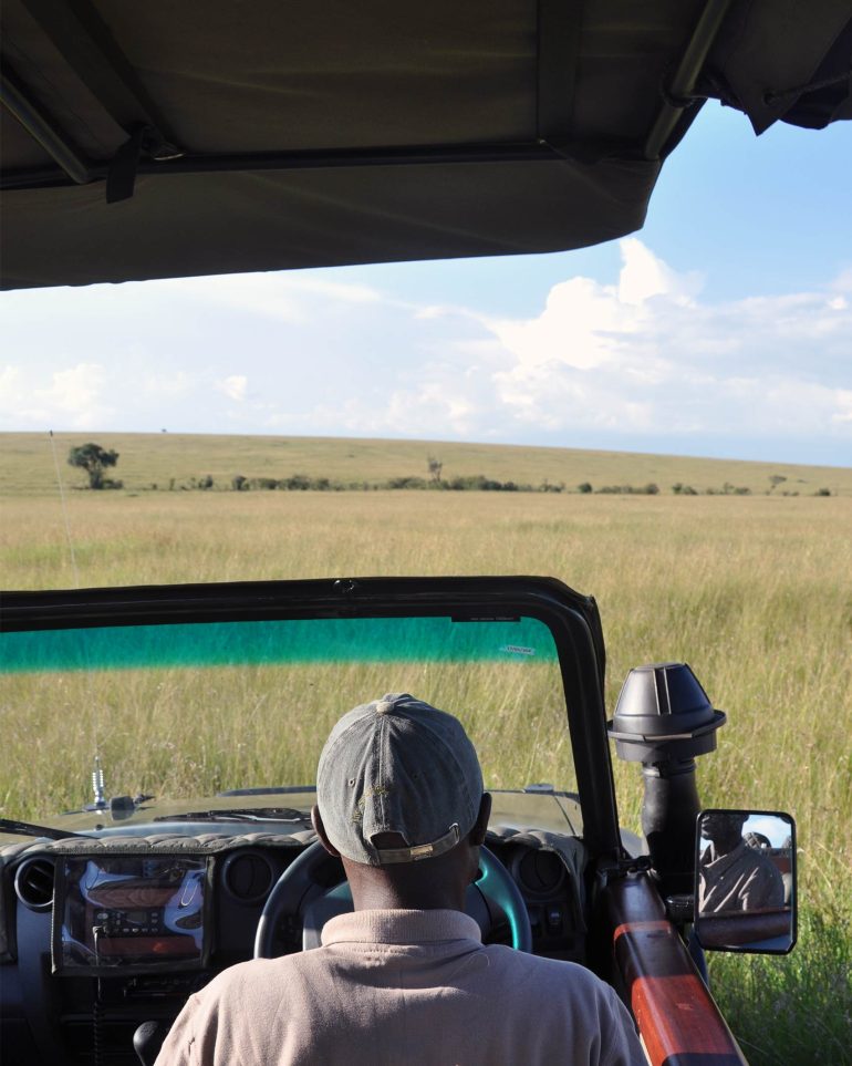 Samson at Sala's Camp on the lookout for pangolins in the Masai Mara National Reserve, Kenya