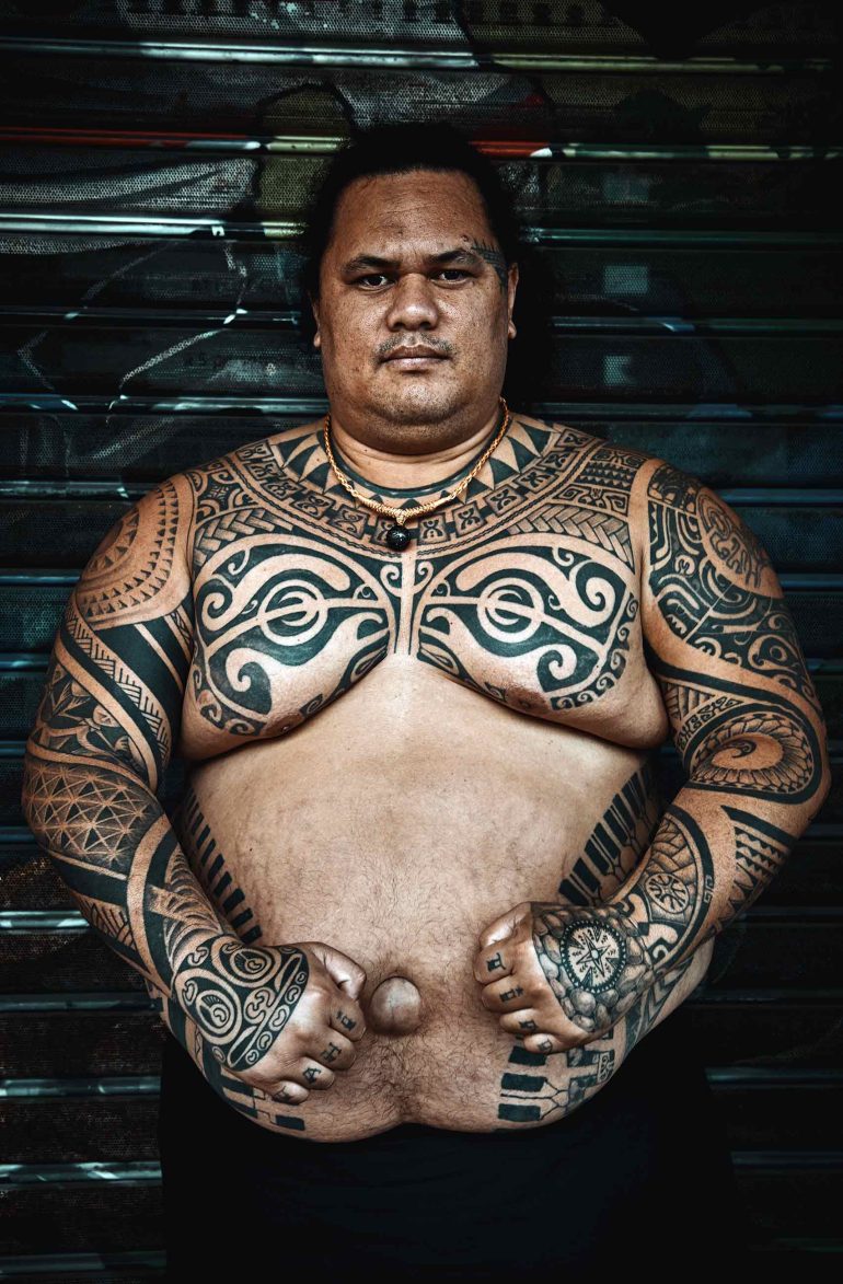 Local man sporting traditional tattoos in The Islands of Tahiti, French Polynesia