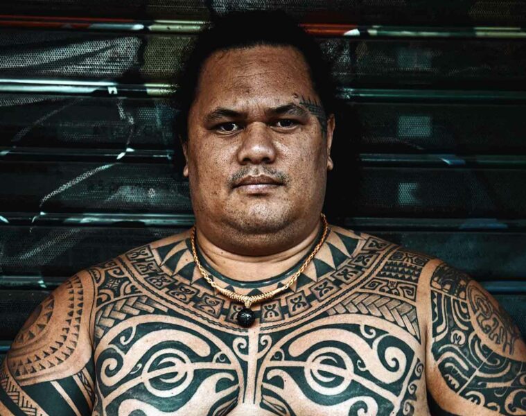 Local man sporting traditional tattoos in The Islands of Tahiti, French Polynesia