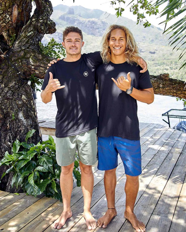 Local men pose for a picture in The Islands of Tahiti, French Polynesia