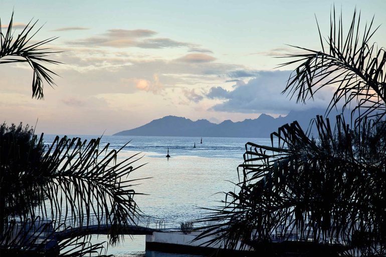 Twilight at sea in The Islands of Tahiti, French Polynesia