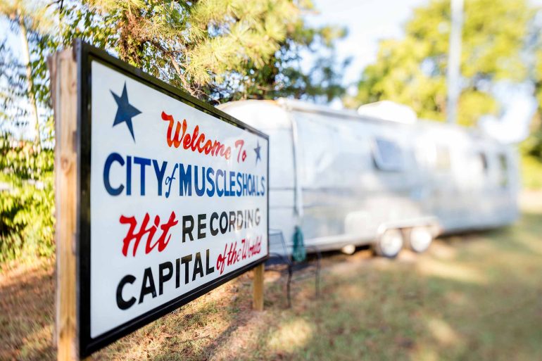 A sign welcoming visitors to Muscle Shoals on the Trail of tears, Alabama, USA