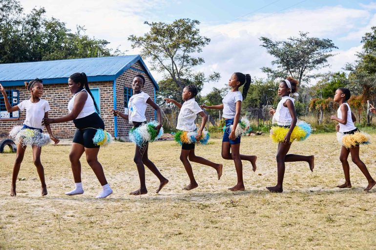 Local school children perform a dance near the Shambala Private Game Reserve, South Africa