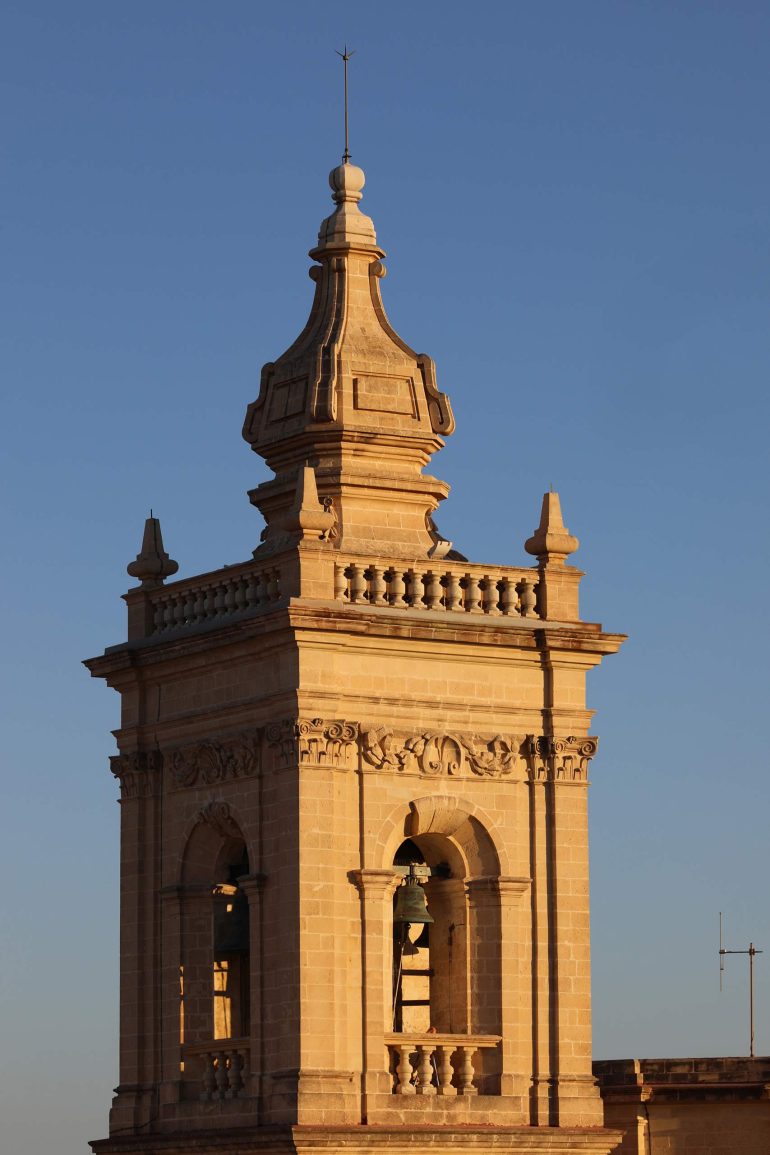 A Maltese bell tower at sunset