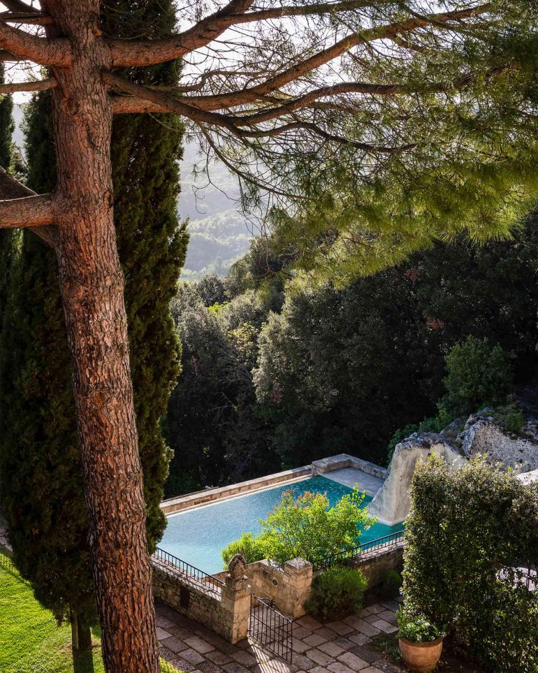 View over the infinity pool at Borgo Pignano, Tuscany, Italy