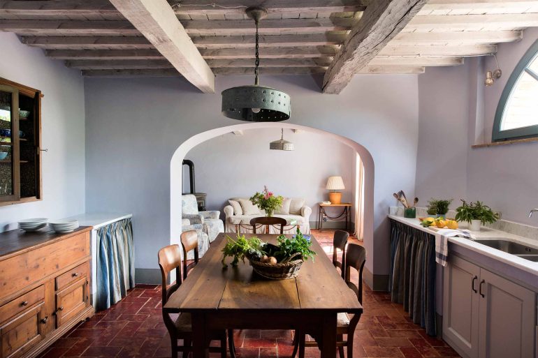 Freshly harvested produce sits on a dining table at the Borgo Pignano, Tuscany, Italy
