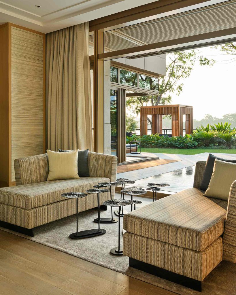A carefully designed lounge area open to the garden at Capella Bangkok, Thailand