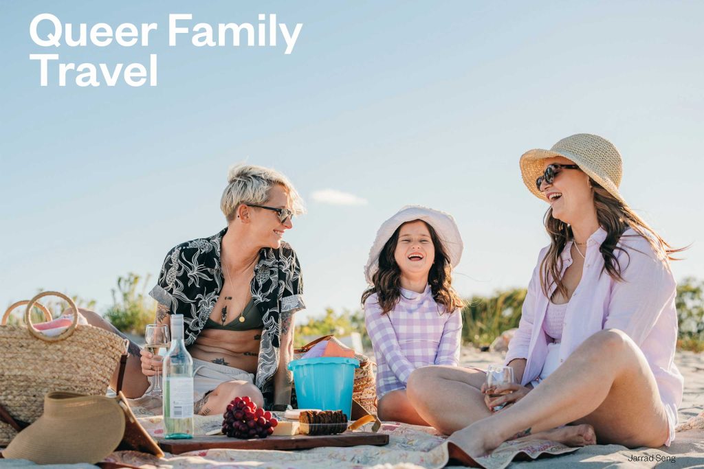 Mothers enjoy a holiday with their daughter on the beach. The Future of Queer Travel, Globetrender