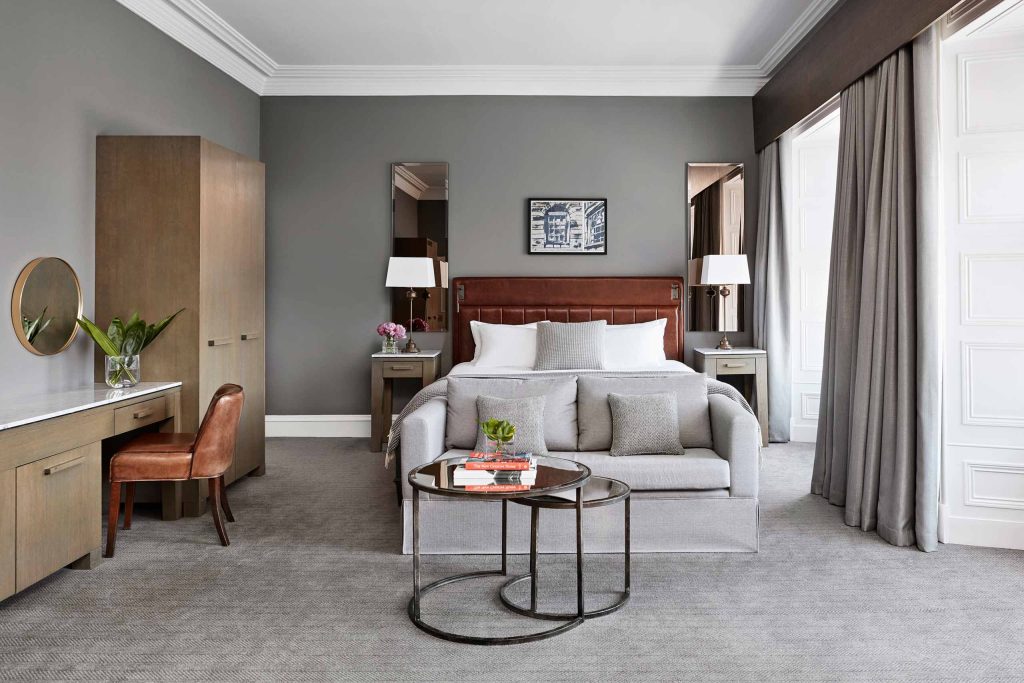 A stylish bedroom at Kimpton Blythswood Square, Glasgow, Scotland.