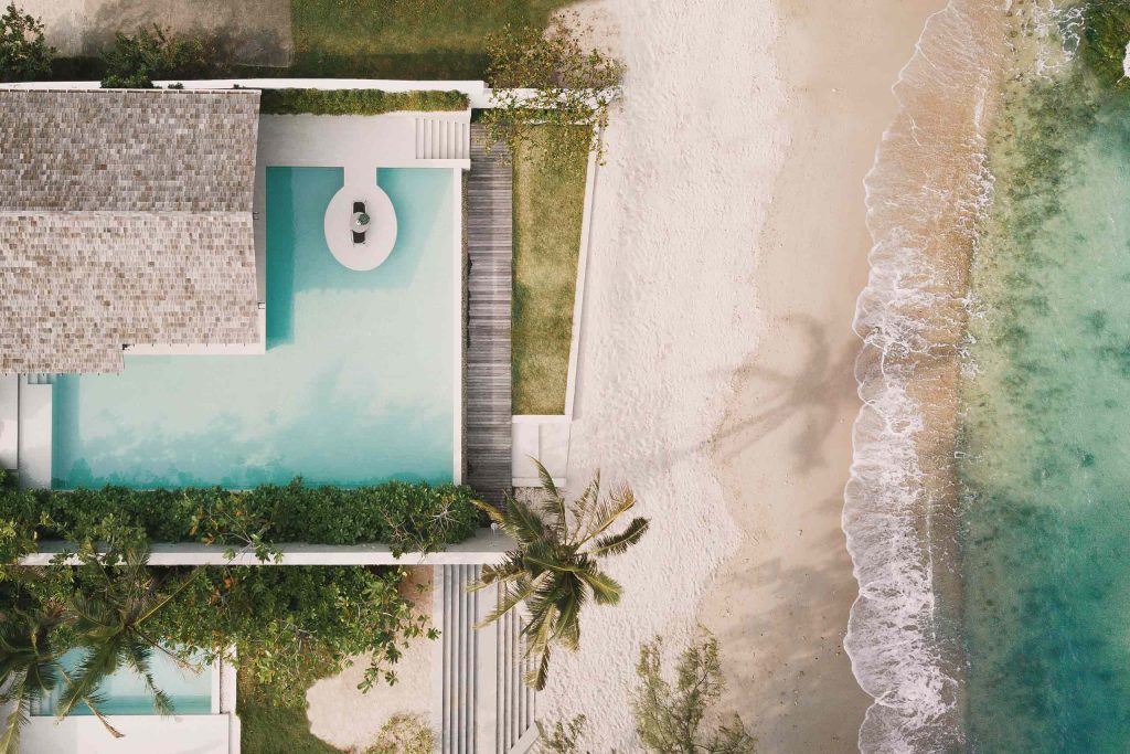 Birds eye view of Kimpton Kitalay Samui showing how close it is to the beach and sea