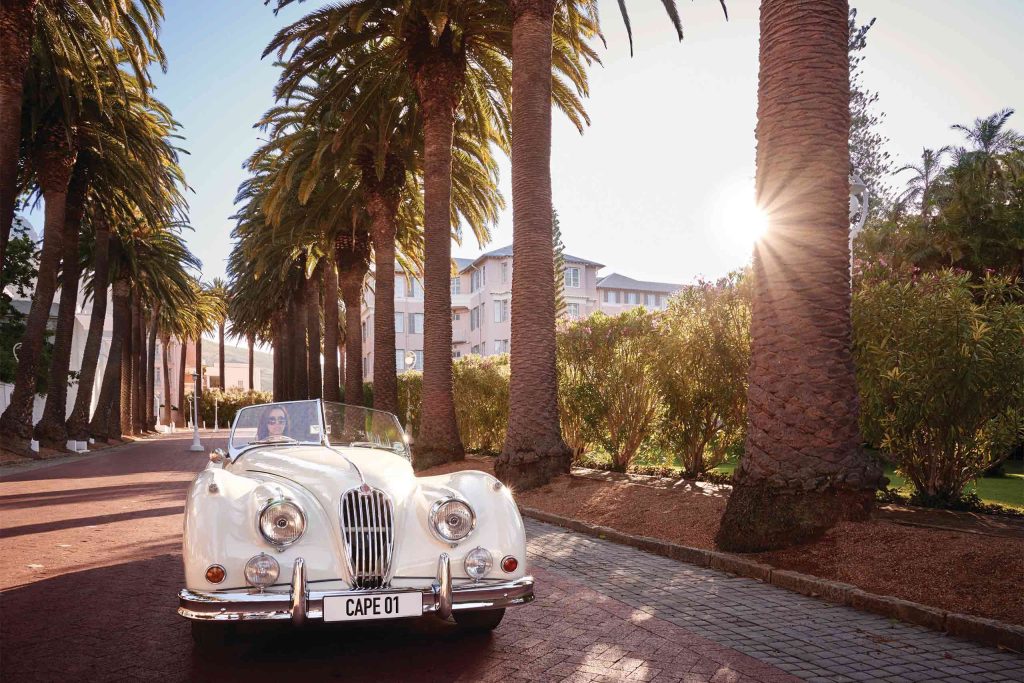 A vintage car on the driveway of the Mount Nelson, A Belmond Hotel, Cape Town, South Africa