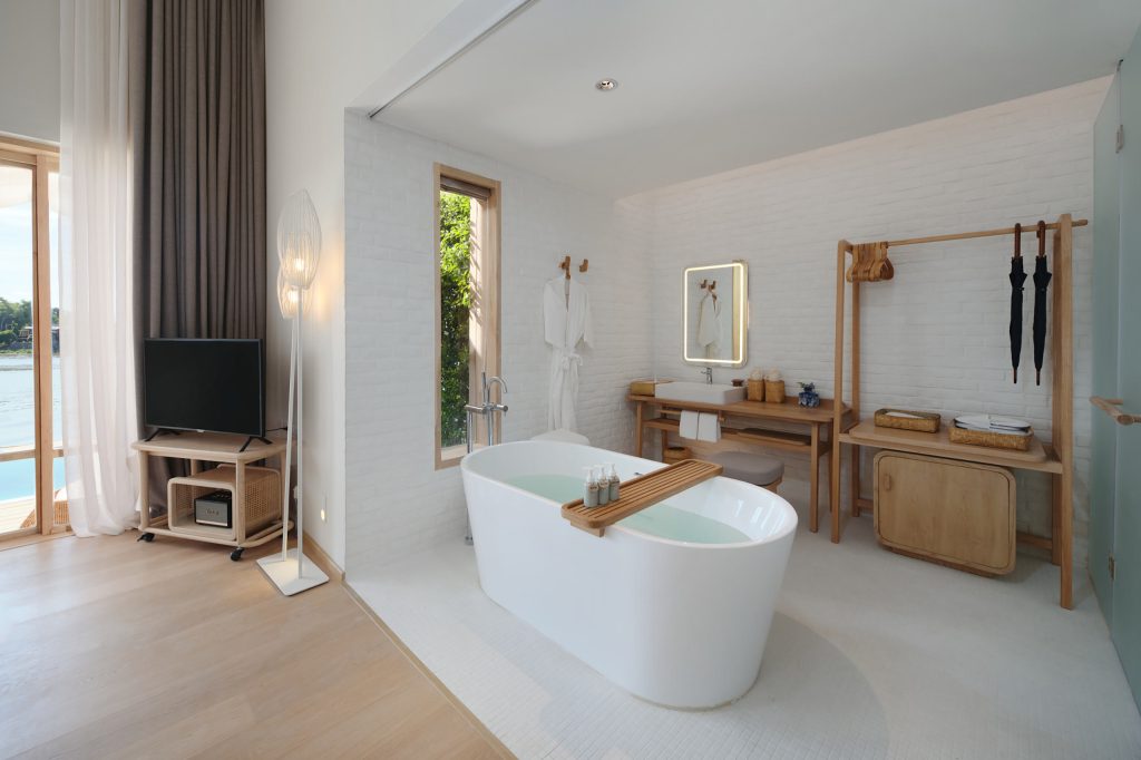 A minimal, eco-style bathroom with a freestanding bathtub 