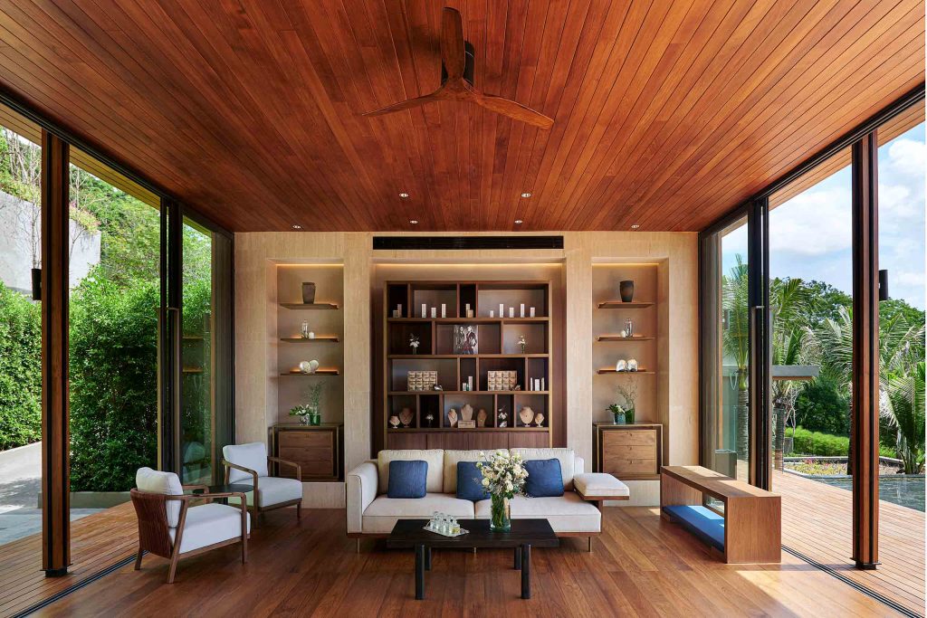 A contemporary lounge space with a teak wood floor and ceiling