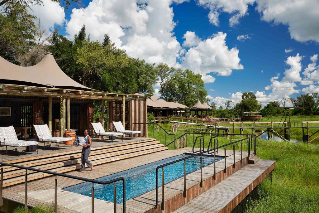 A pool offers views of the surrounding landscape at Xigera Safari Lodge, Okavango Delta, Botswana