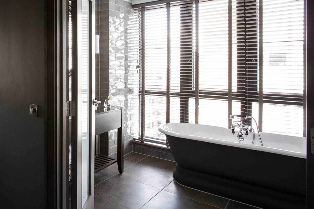 Bathroom with a freestanding bathtub at Dakota Hotel Glasgow, Glasgow.