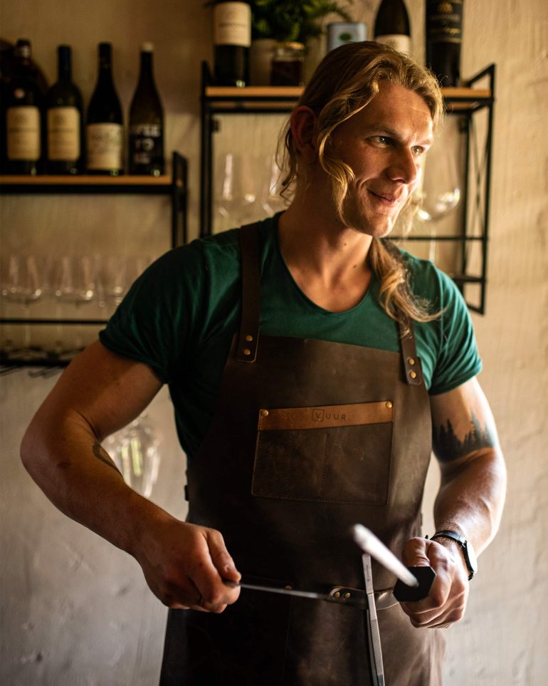 An assisting chef at VUUR Restaurant, Western Cape, South Africa