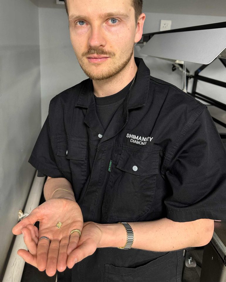 Steffen Michels holds up a polished diamond at Shimansky, Cape Town, Western Cape, South Africa