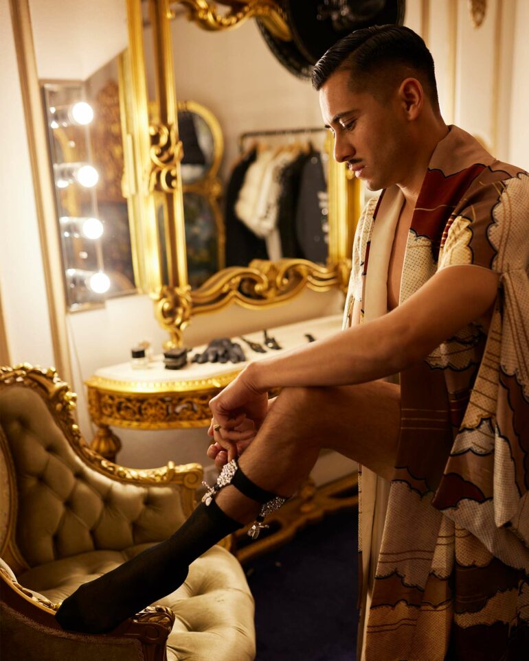 David Padilla puts on socks at the Los Angeles Theatre in California, USA