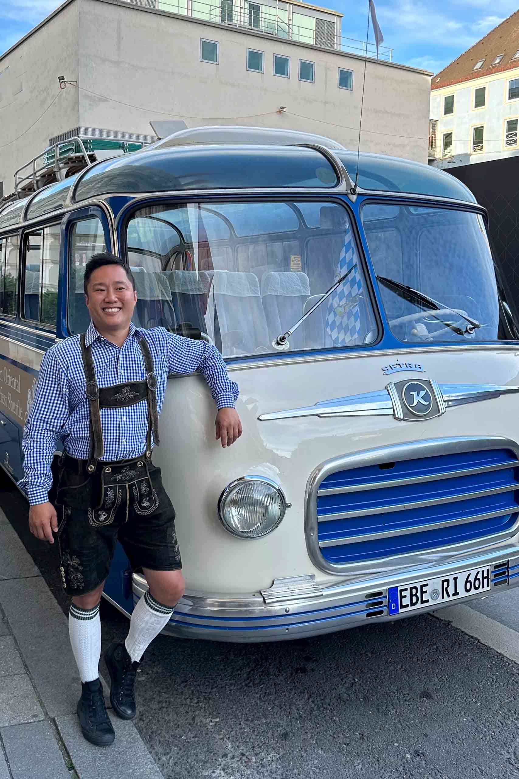 Uwern Jong beside the Mandarin Oriental Oktoberfest Shuttle bus.