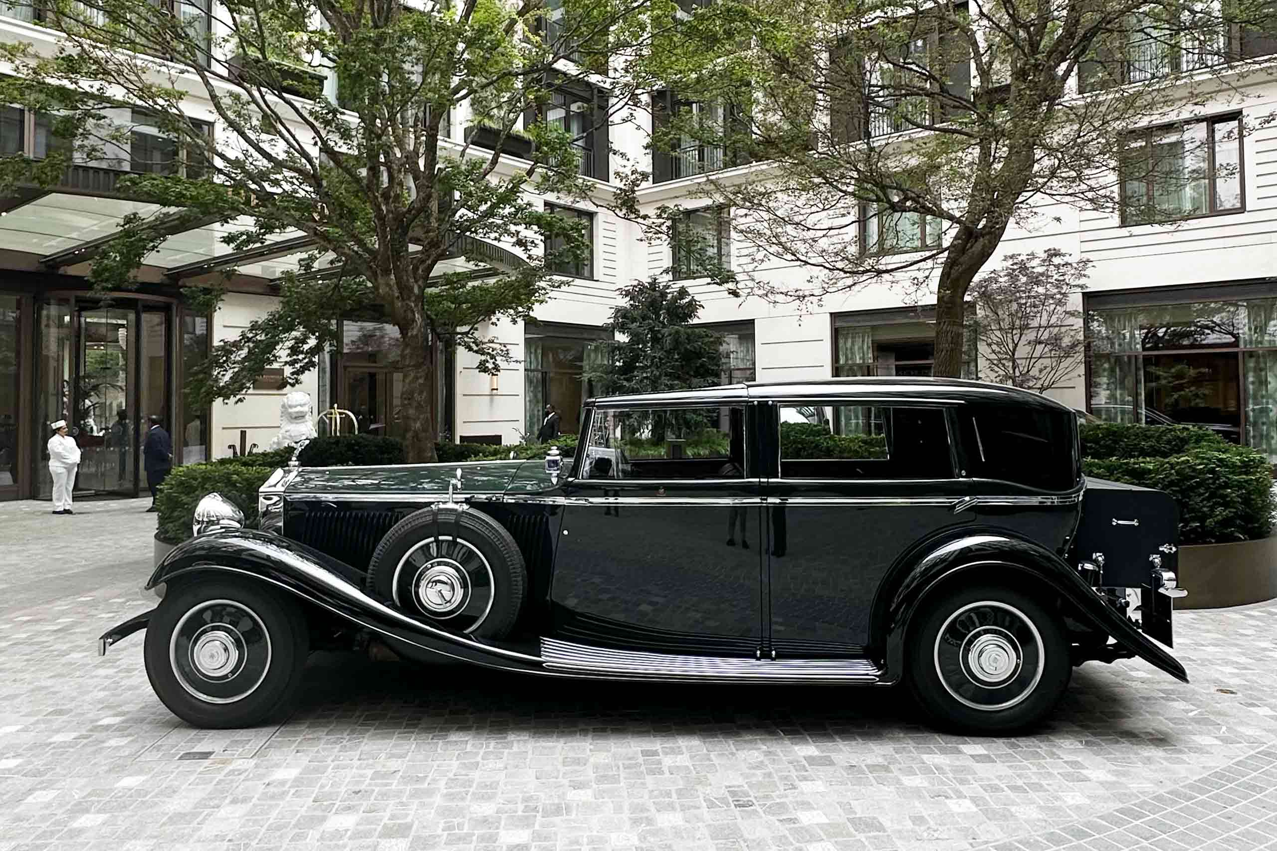 A classic car outside of The Peninsula London.