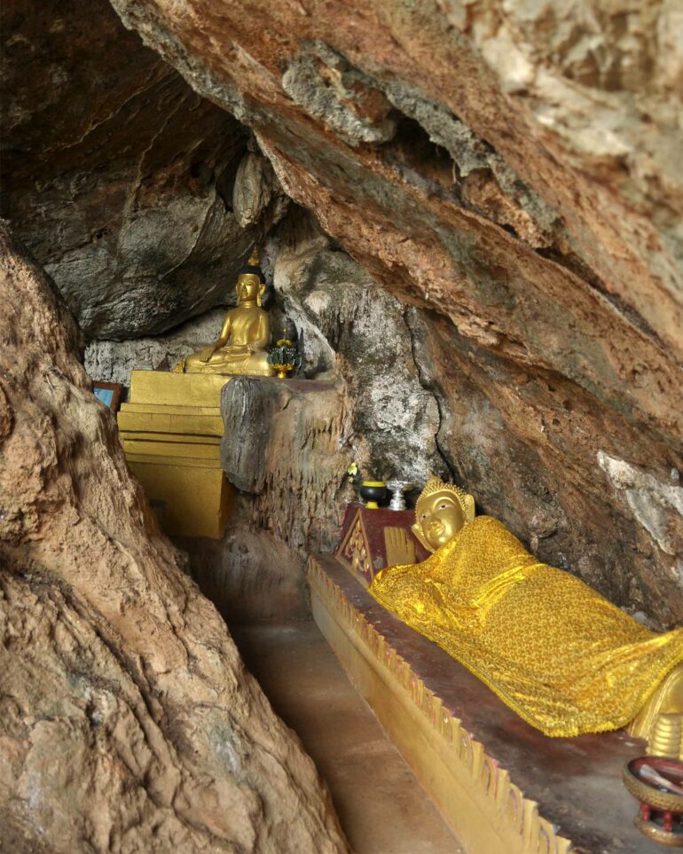 A small Buddhist shrine in a cave as seen during a Chiang Mai tuk-tuk lesson in rural Thailand