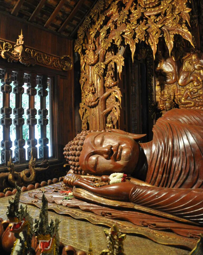 A carved tea Buddha statue, photographed during a Chiang Mai tuk-tuk lesson in rural Thailand