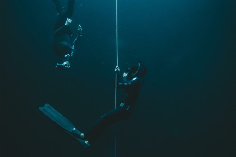 Two divers in a cenote on the Riviera Maya, Mexico
