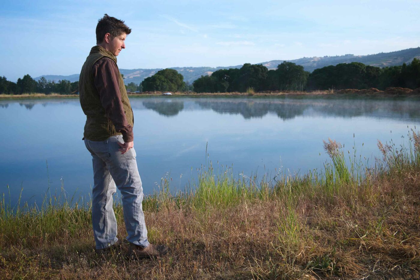 Sarah Cahn Bennett beside a lake at Pennyroyal farm.