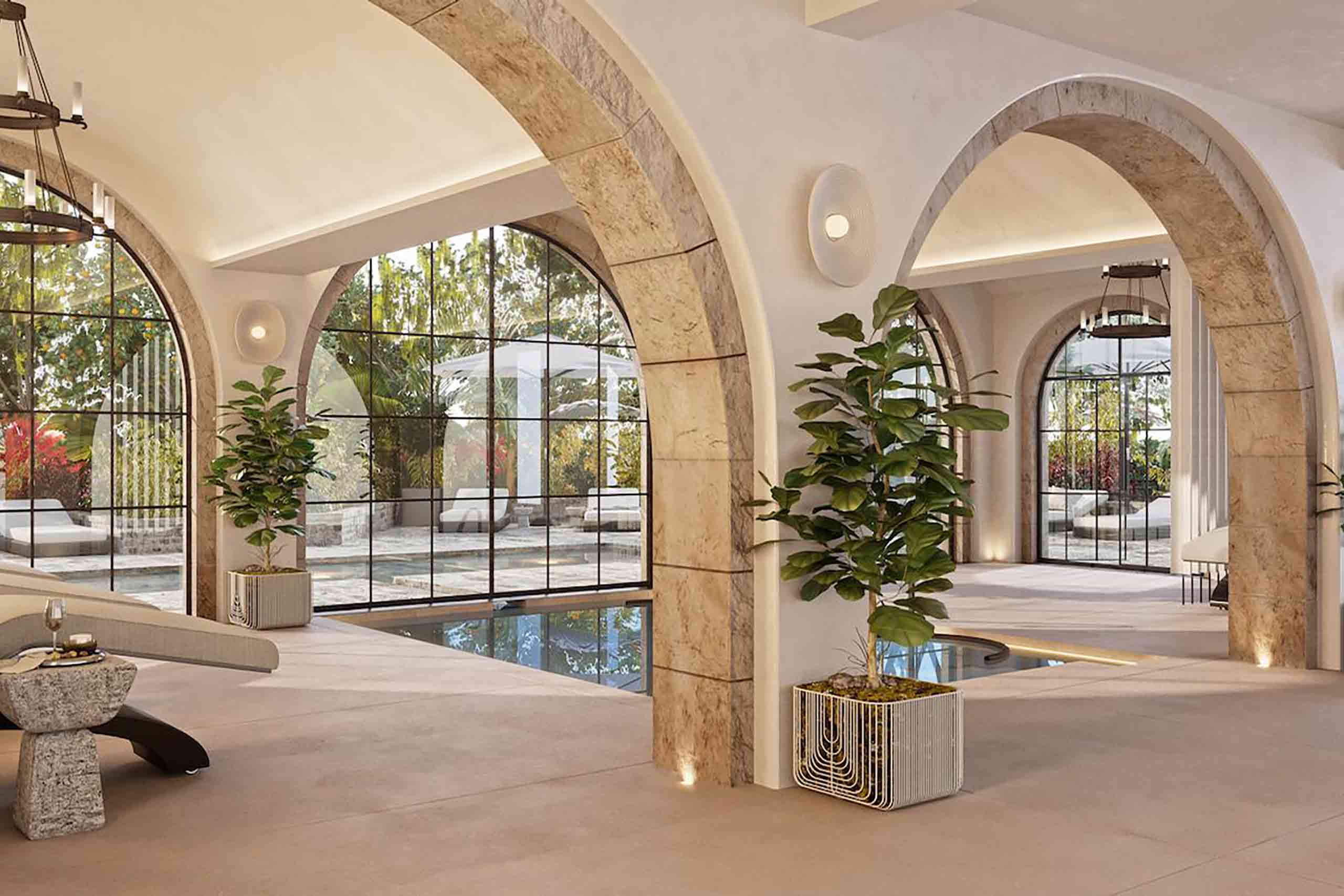 An indoor spa space with arched walls and a pool.