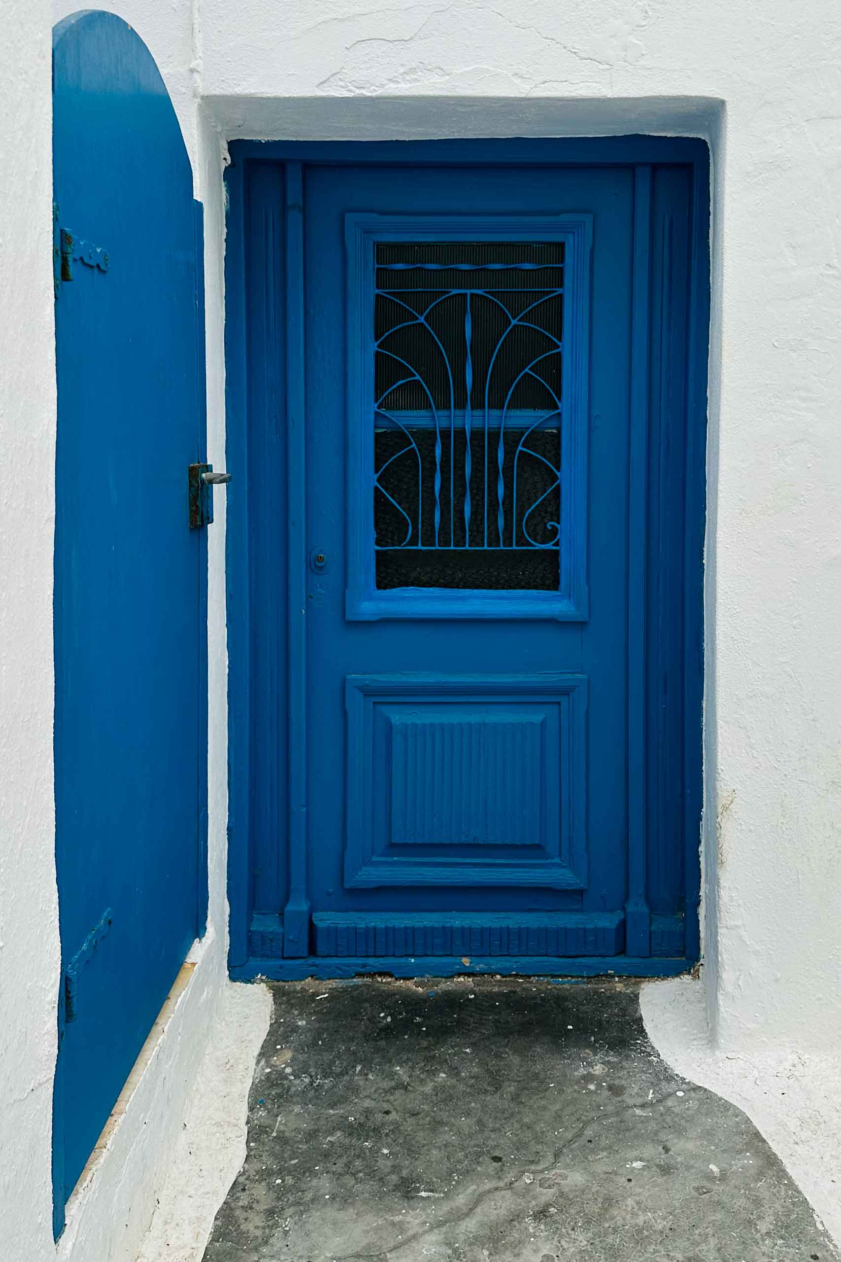 Blue door in Nauossa, Paros. Elegant resorts.