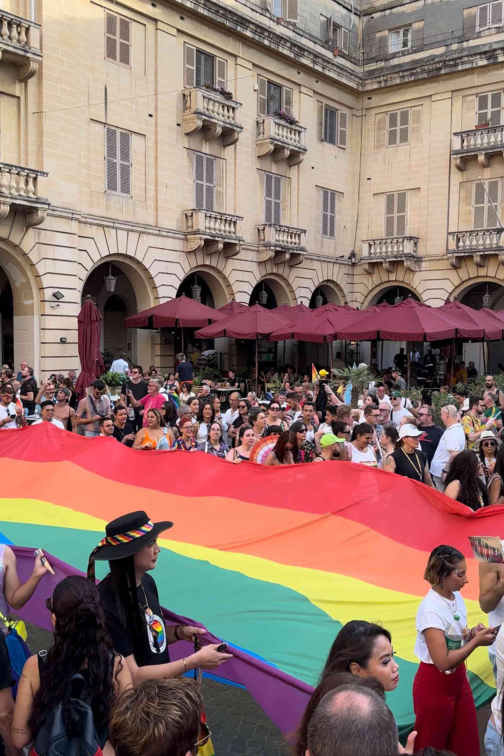 Revellers holding a huge rainbow flag during Europride in Malta.