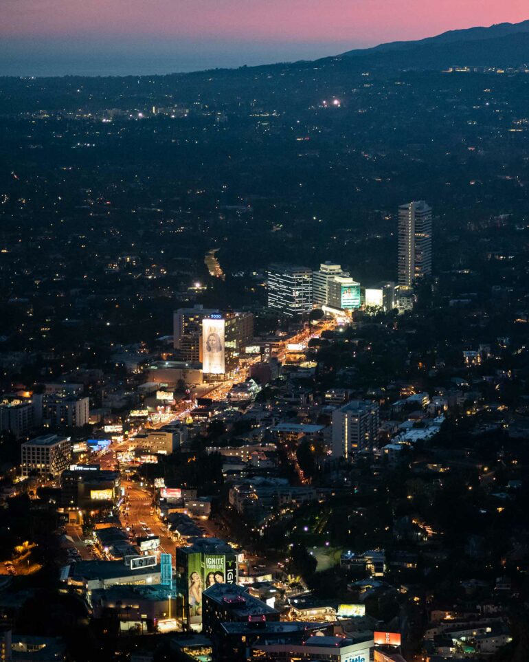 Sunset Strip with Hollywood Hills background at sunset.