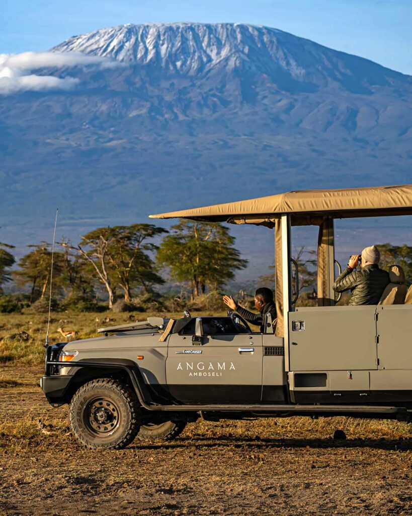A safari vehicle in front of Mount Kilimanjaro