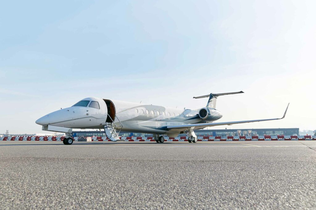 A private jet on an airport landing strip