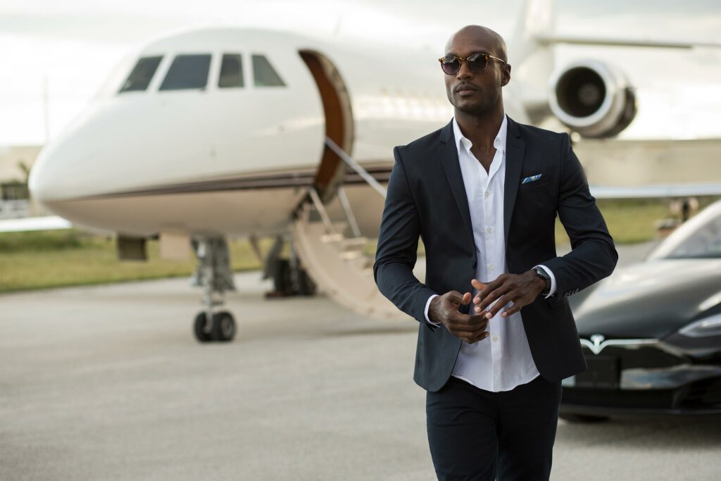A customer gets off a private jet arranged by Victor