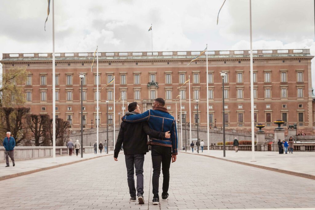 A queer couple visit The Royal Palace. One of the many gifts and experiences in Stockholm.