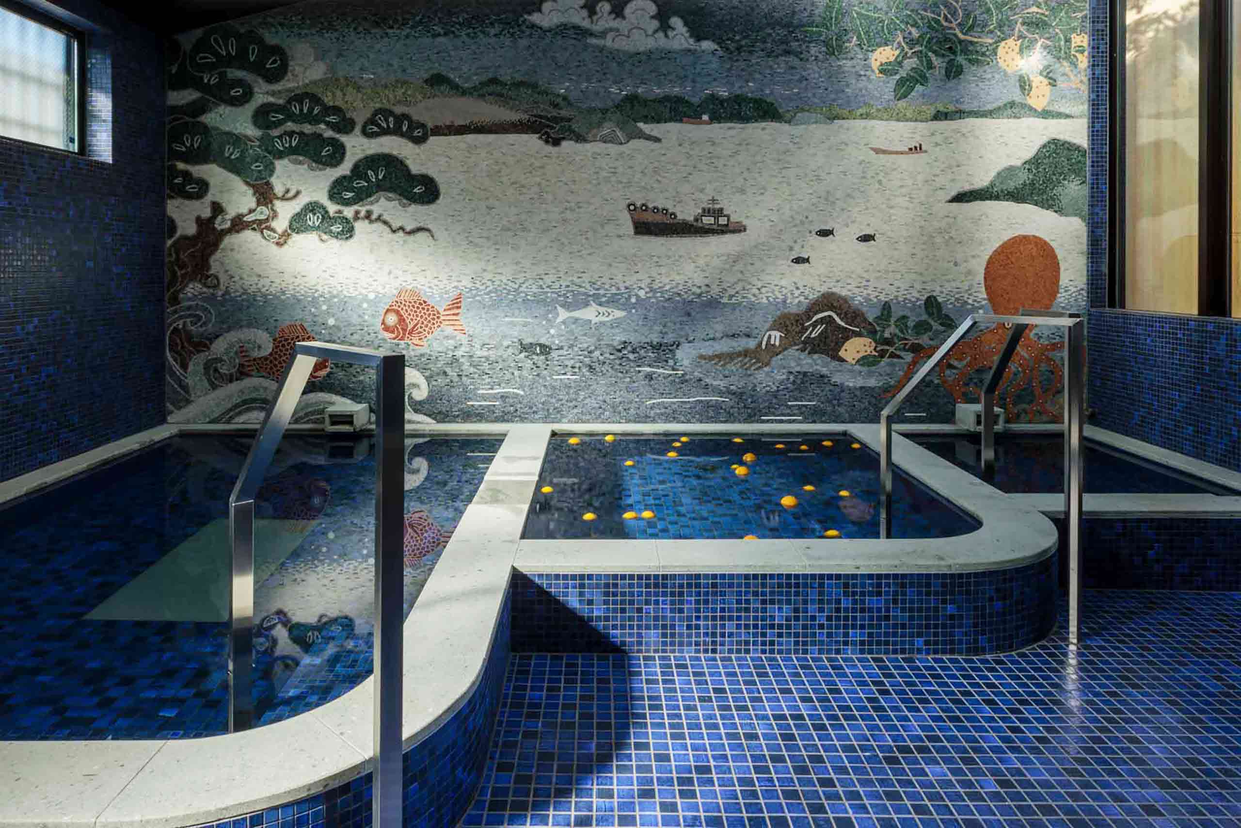 Azumi Setoda indoor pool with art gracing the walls. 
