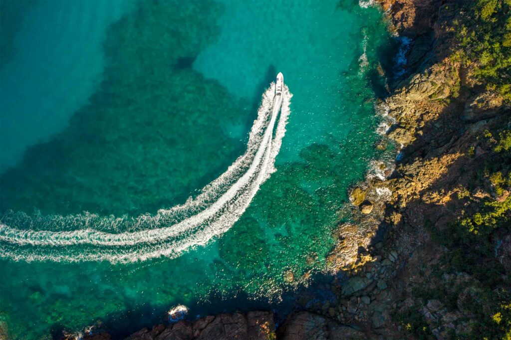 A yacht cruises the turquoise waters of the British Virgin Islands