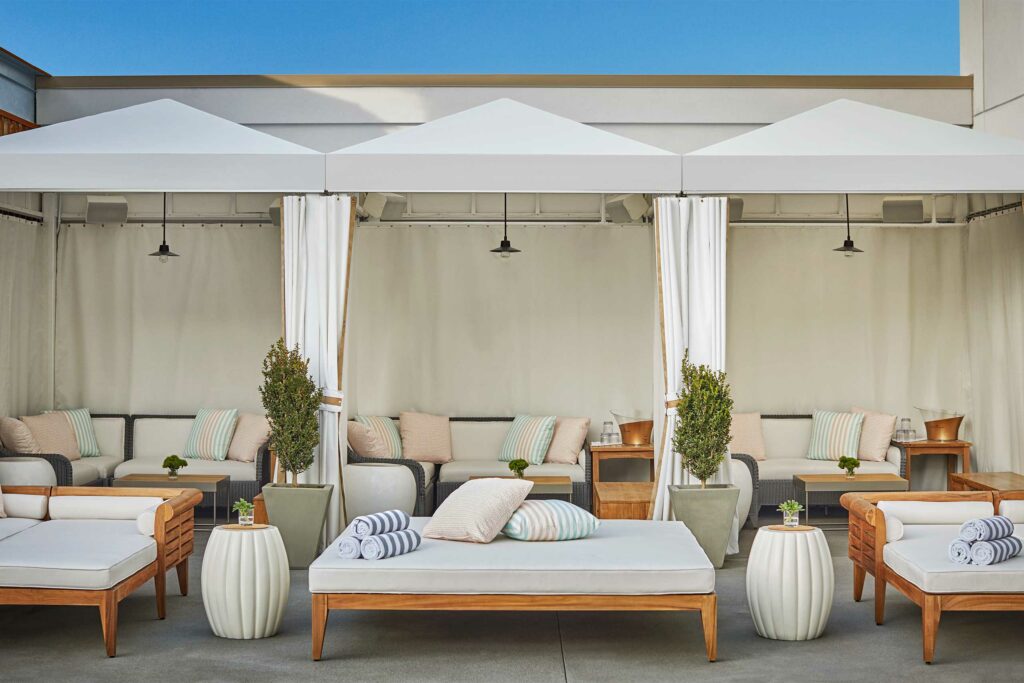 Sun loungers beside the rooftop pool at Pendry San Diego, California, USA.