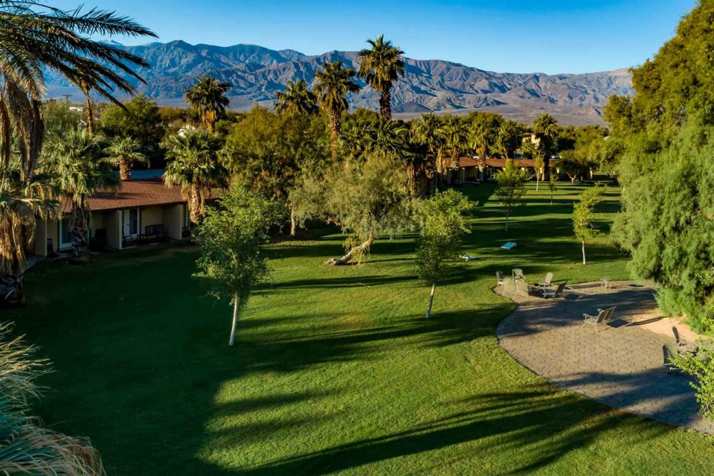 A lush, green field on the grounds of The Oasis at Death Valley, California, USA.