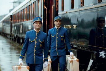 Porters help with luggage on the Venice Simplon-Orient-Express, A Belmond Train